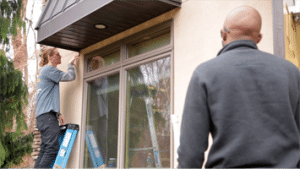 Security Technicians Installing Security Camera on New Jersey Home