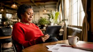 Woman checking AI security app at home