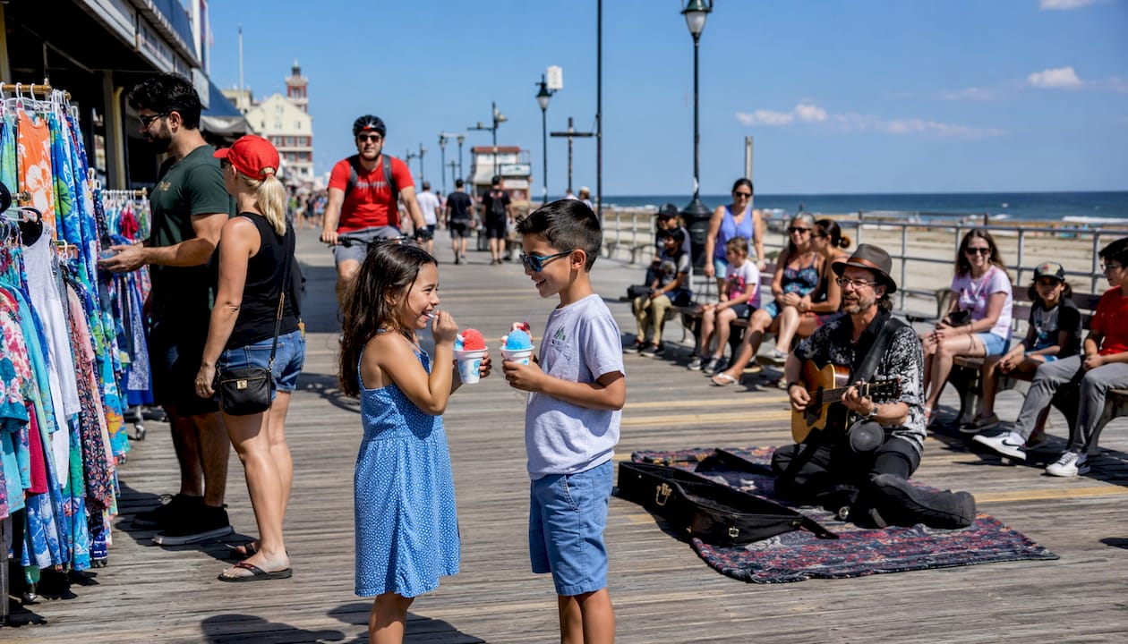 Lively Asbury Park boardwalk with families and musicians
