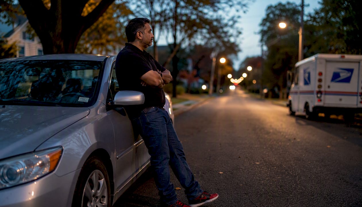Man waiting by car in Marlboro street intersection