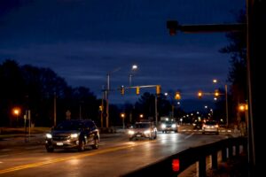 Roadway with discreet license plate reader
