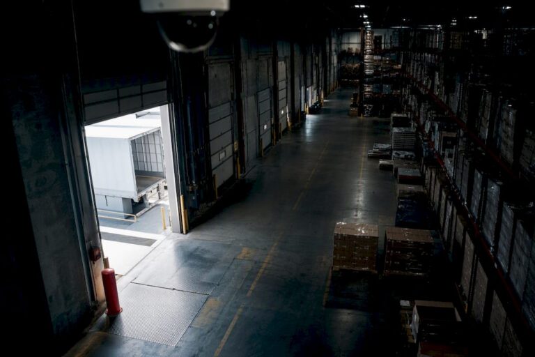 Warehouse interior with layered camera coverage