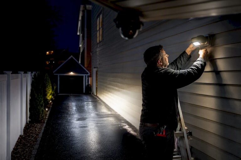 Angled security lighting across a residential driveway