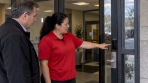 Security team inspecting office access control hardware